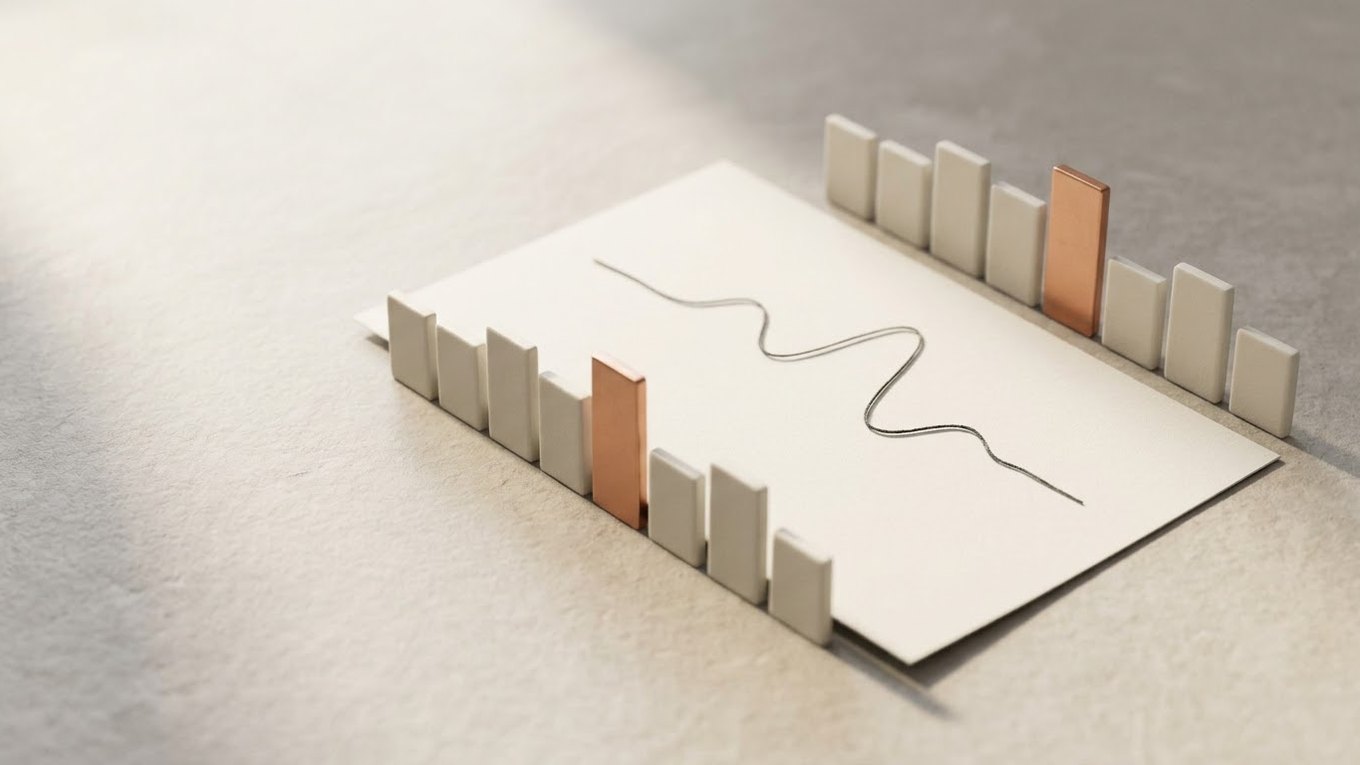 Two rows of small off-white ceramic tiles stand like twin leaderboards beside a sheet of paper with a thin graphite line, with one copper tile raised in each row.